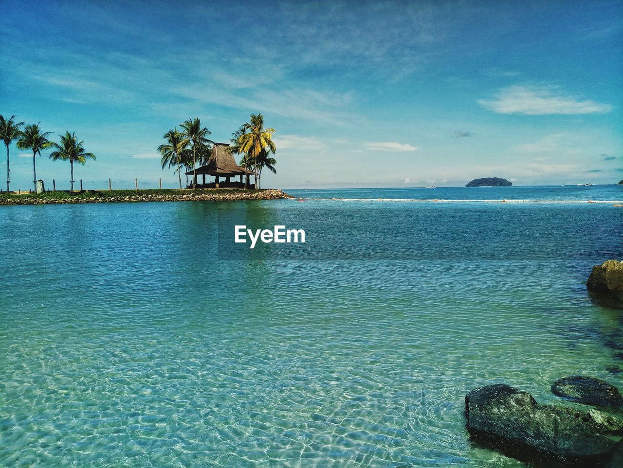 Scenic view of sea against blue sky