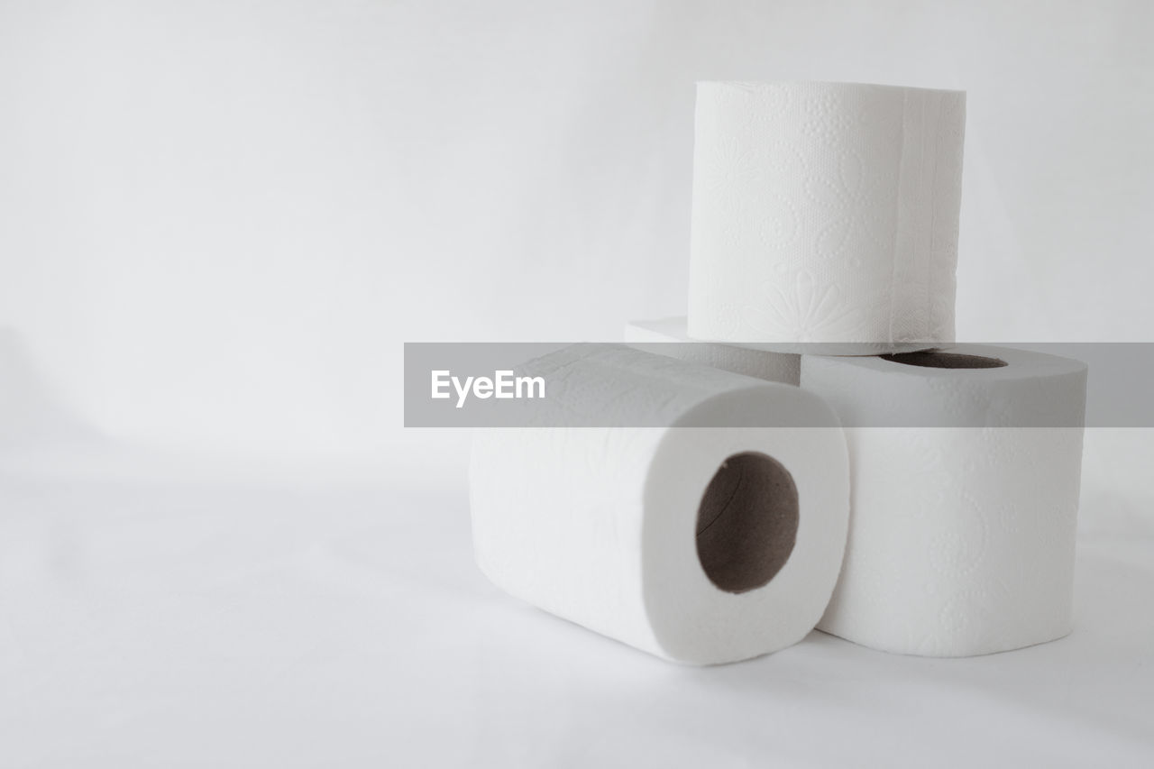 toilet paper, paper towel, paper, rolled up, cylinder, indoors, white, hygiene, no people, studio shot, copy space, white background, single object, domestic room, simplicity, lighting