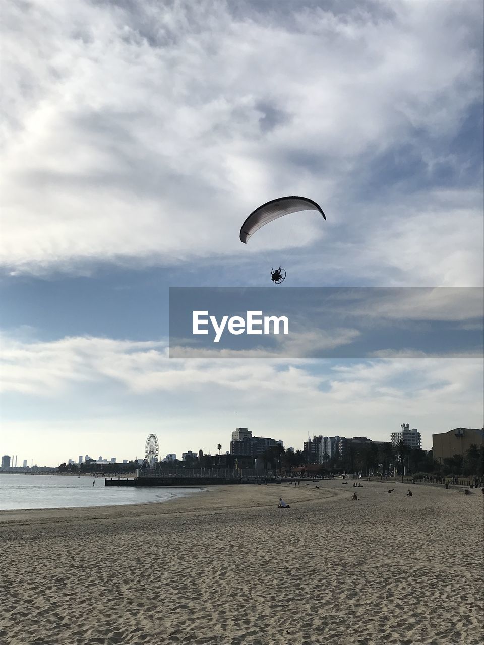 A paraplane over st kilda beach. australia