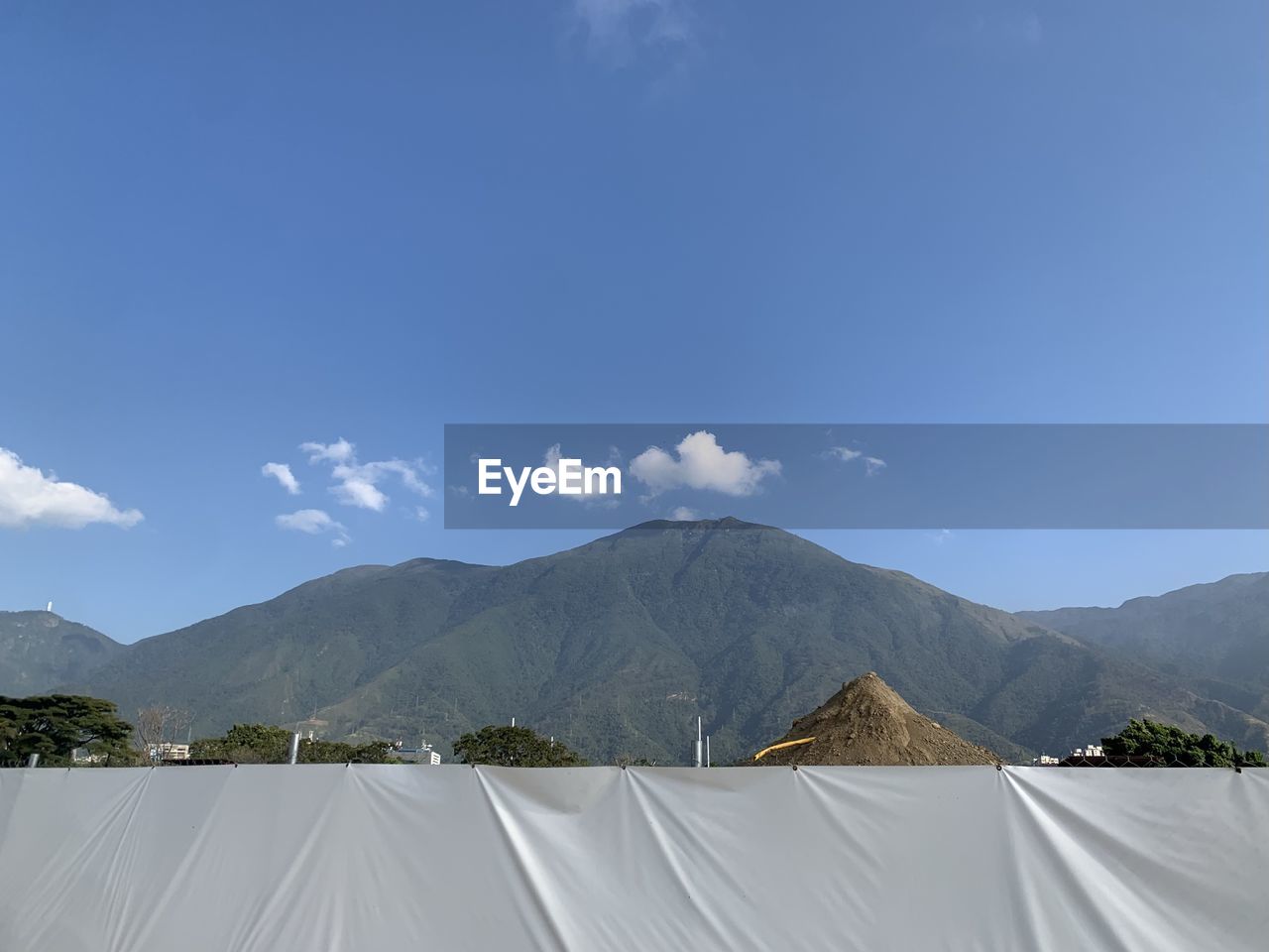 mountain, sky, environment, mountain range, nature, landscape, scenics - nature, cloud, blue, no people, land, beauty in nature, travel, travel destinations, plant, outdoors, day, tent, tranquility, tourism, architecture