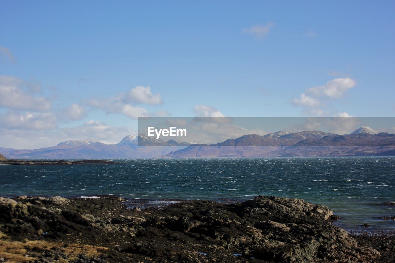 SCENIC VIEW OF SEA AND MOUNTAINS