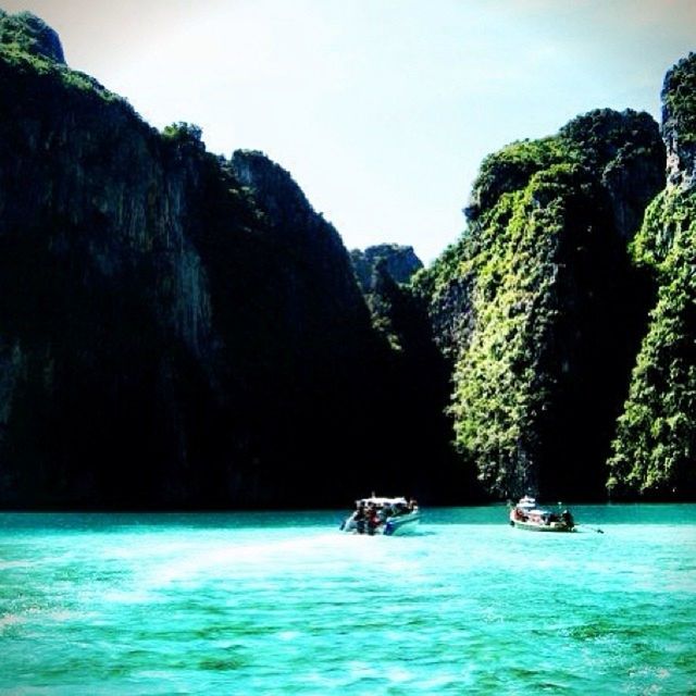 SCENIC VIEW OF BOATS SAILING IN SEA