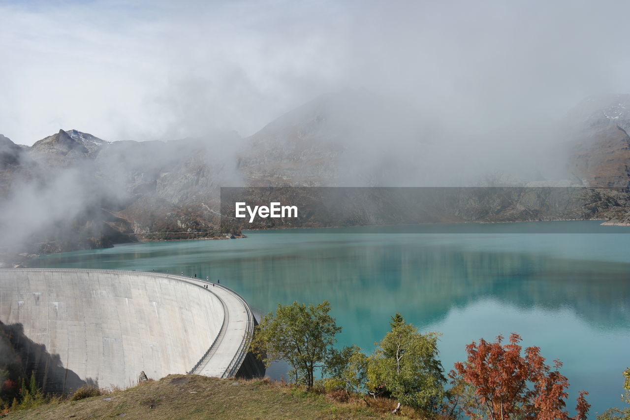 Scenic view of dam against mountain