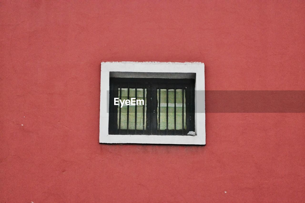 Close-up of window on brick wall