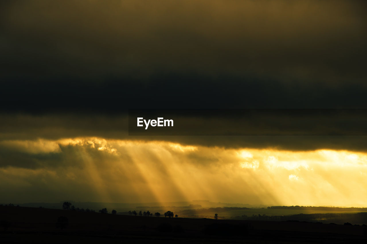 Scenic view of dramatic sky during sunset