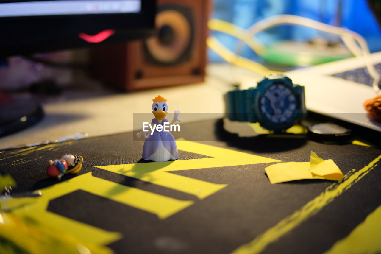 CLOSE-UP OF FIGURINE ON TABLE