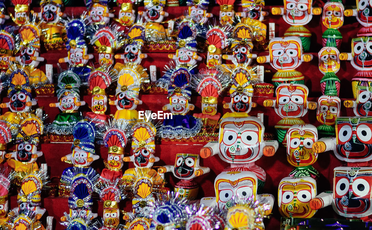 Statues on god for sale at market stall