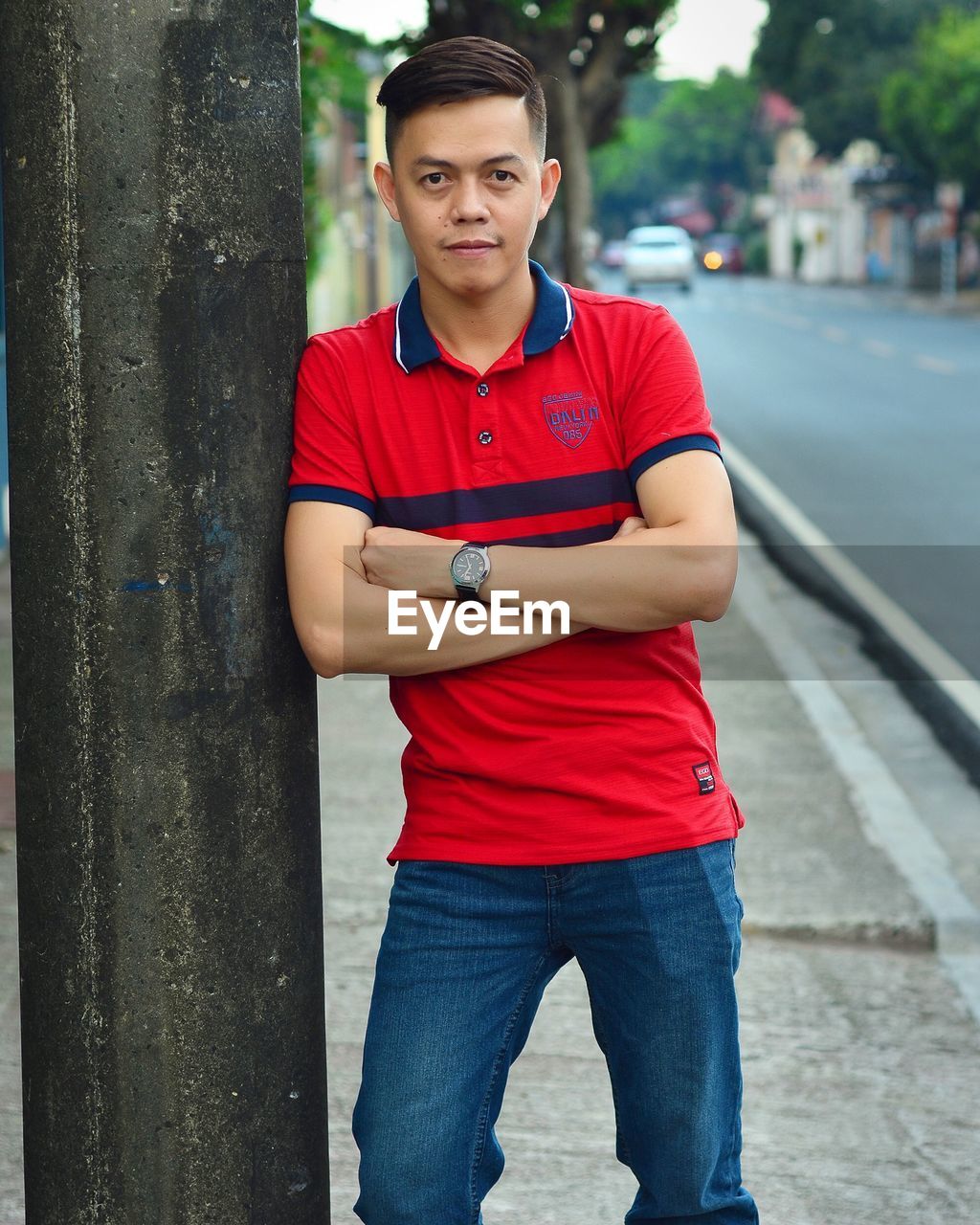 Portrait of man leaning on wall