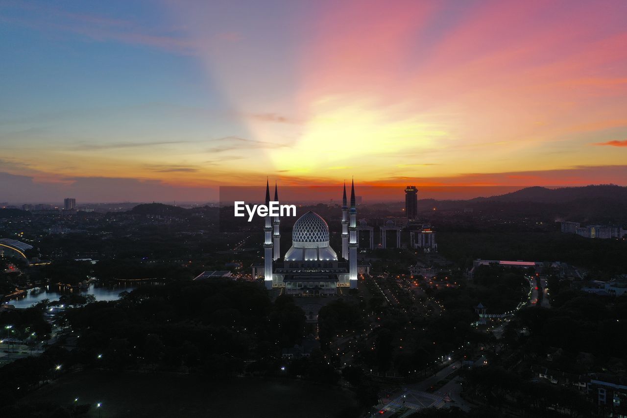 View of buildings against sky during sunset