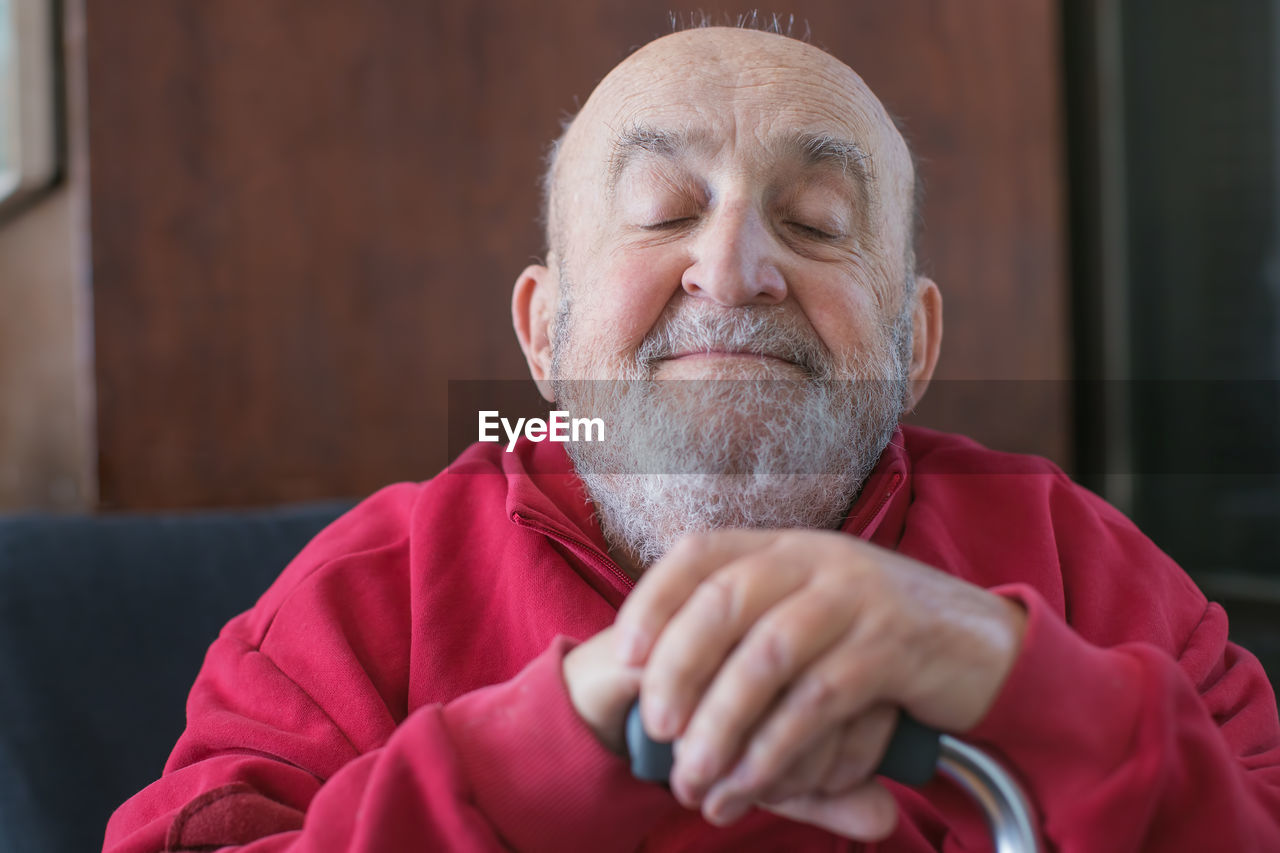 Close-up of senior man with closed eyes