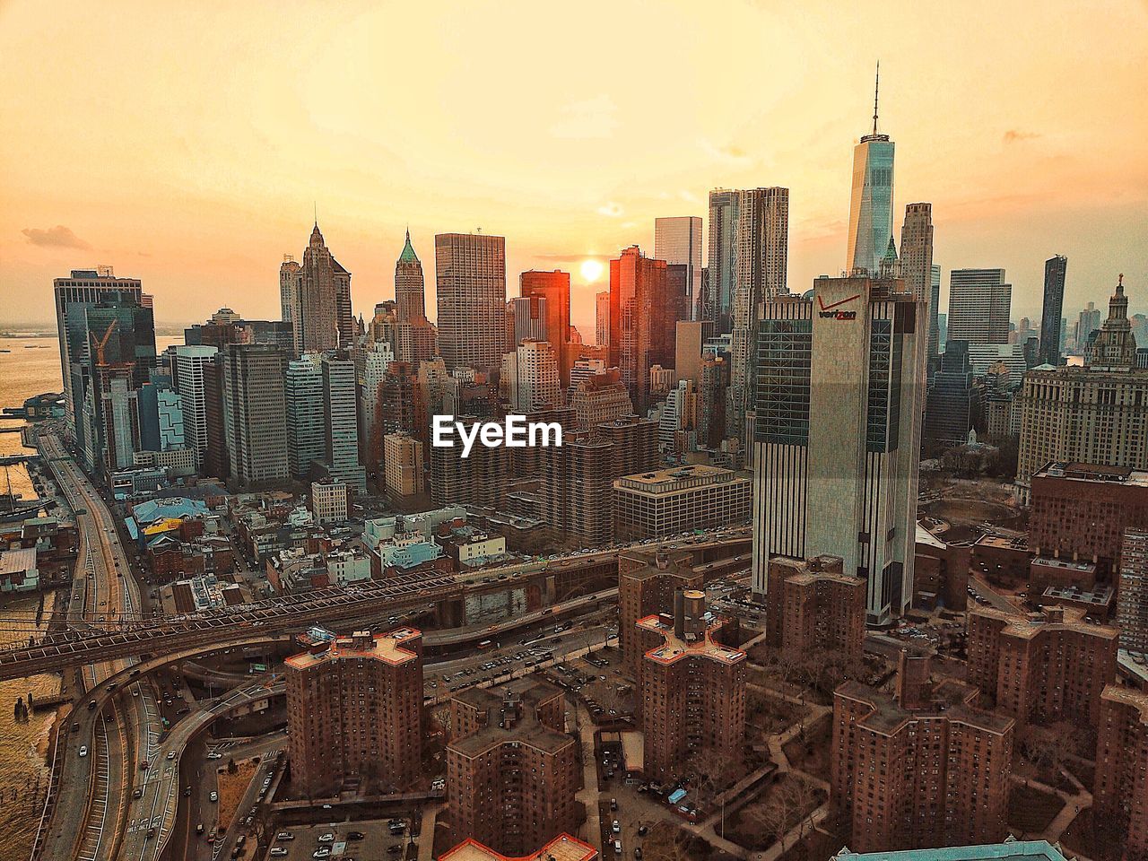 AERIAL VIEW OF CITY BUILDINGS AT SUNSET