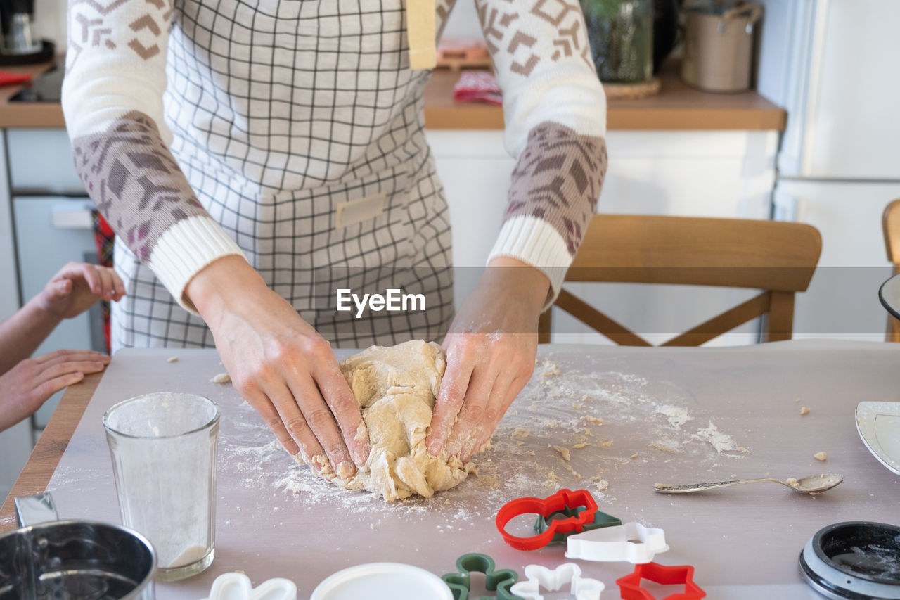 midsection of man preparing food in kitchen