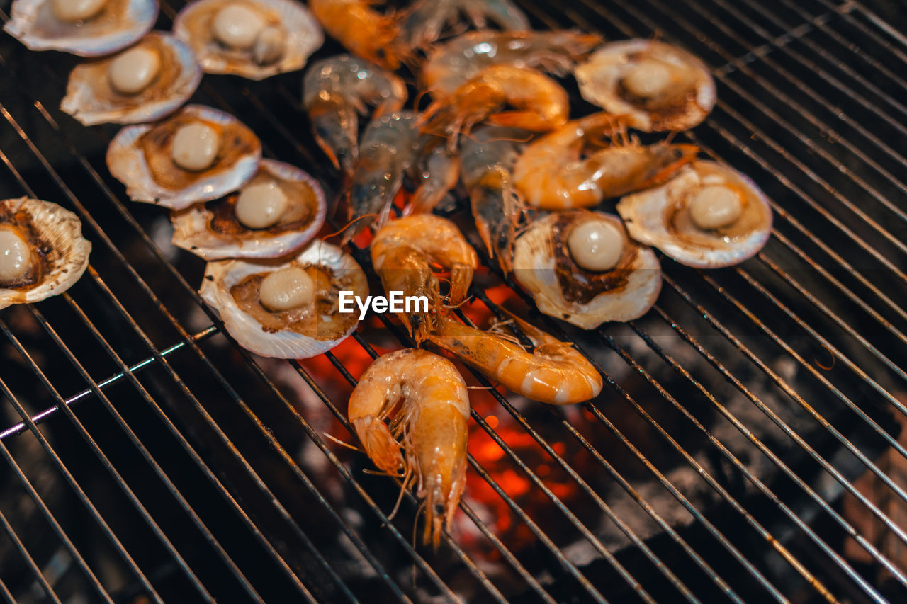 high angle view of sausages on barbecue grill