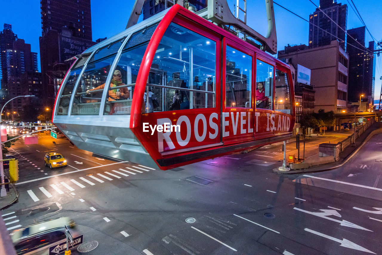 Overhead cable car over illuminated street at roosevelt island