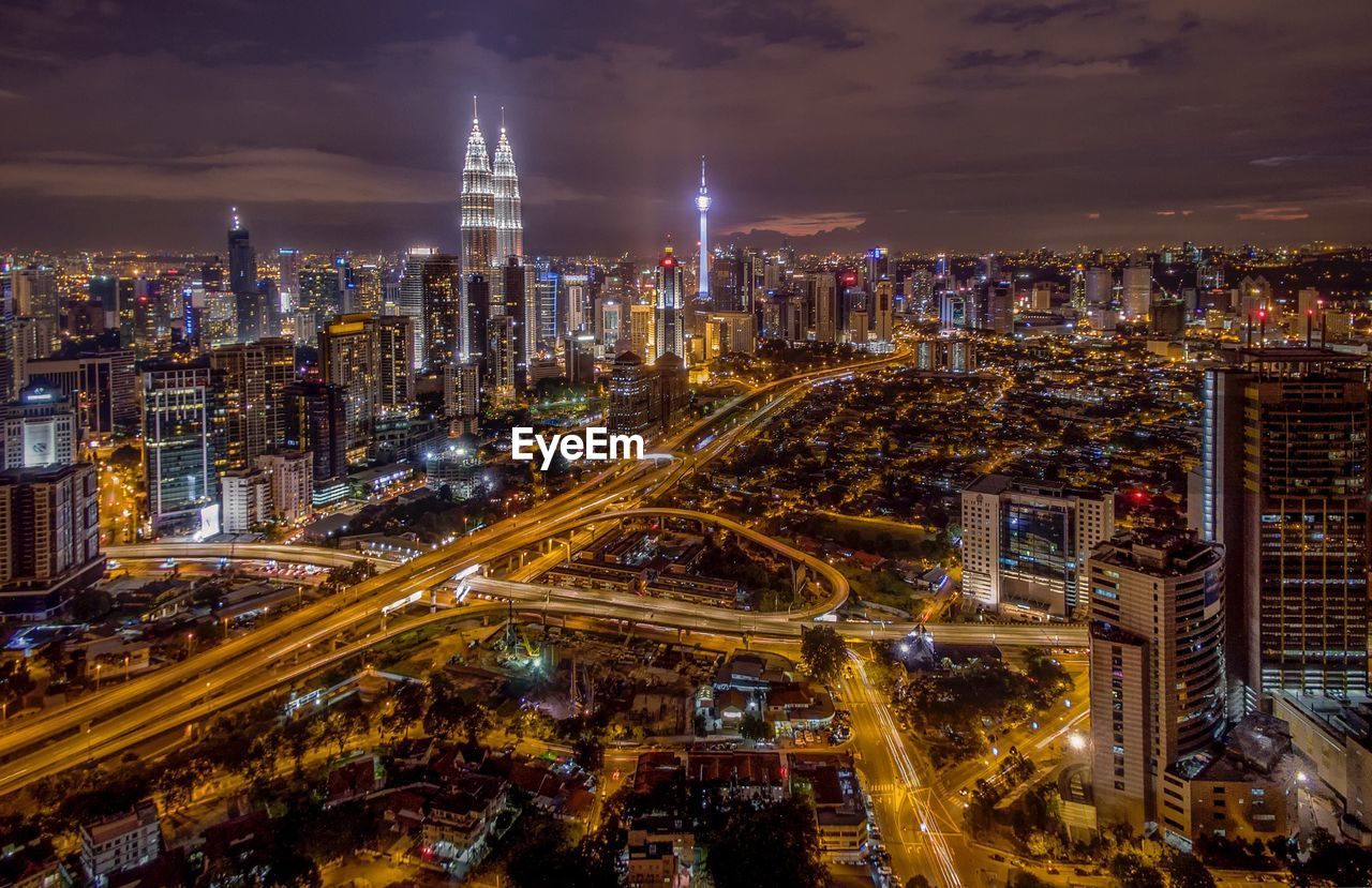 HIGH ANGLE VIEW OF ILLUMINATED CITYSCAPE