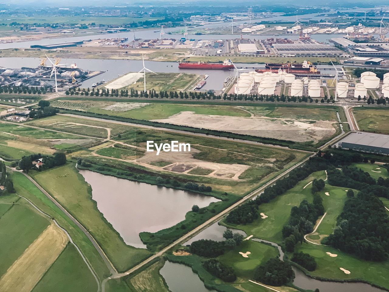 High angle view of river amidst buildings