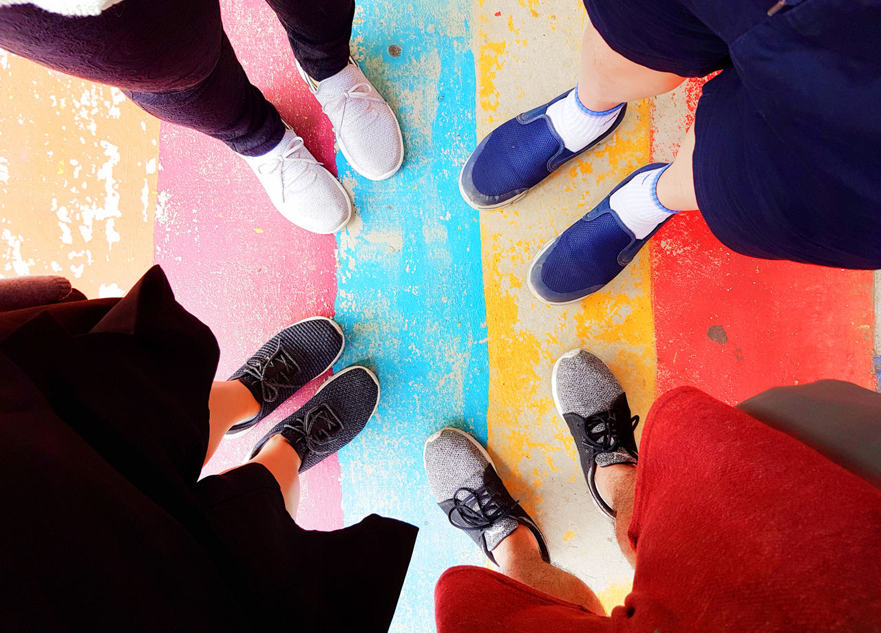 Standing firm and walking down the rainbow path together as a family The Still Life Photographer - 2018 EyeEm Awards Adult Body Part Day Directly Above Friendship Group Of People High Angle View Human Body Part Human Leg Human Limb Leisure Activity Lifestyles Low Section Men Multi Colored Outdoors People Real People Shoe Standing Togetherness The Traveler - 2018 EyeEm Awards