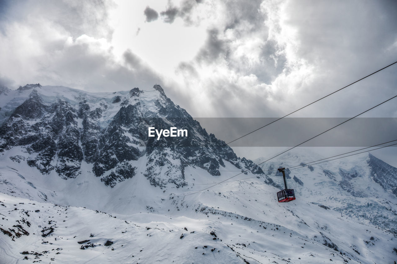 Ski lift on snow covered mountain