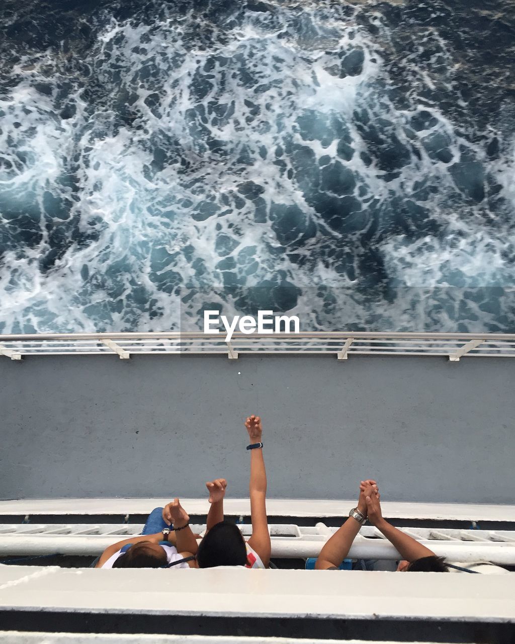 High angle view of people looking at sea