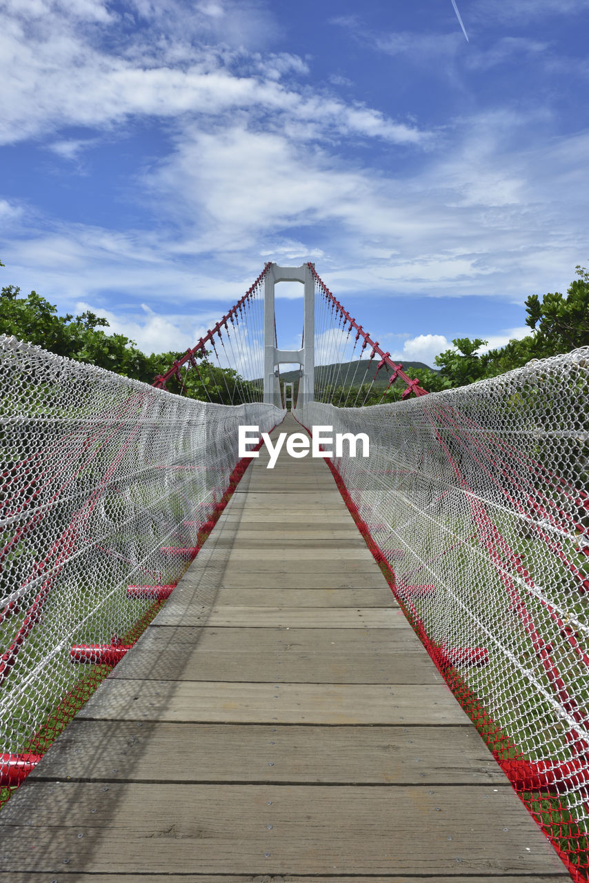 FOOTBRIDGE AGAINST SUSPENSION BRIDGE