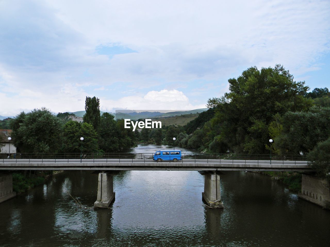 Car on bridge over river