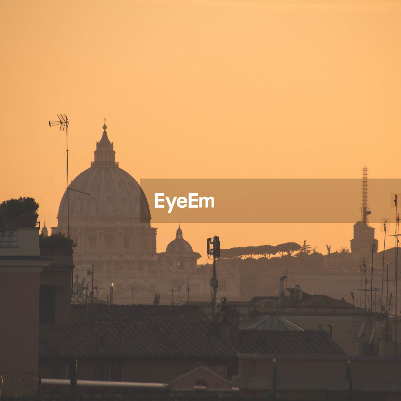 St peter basilica against clear sky during sunset