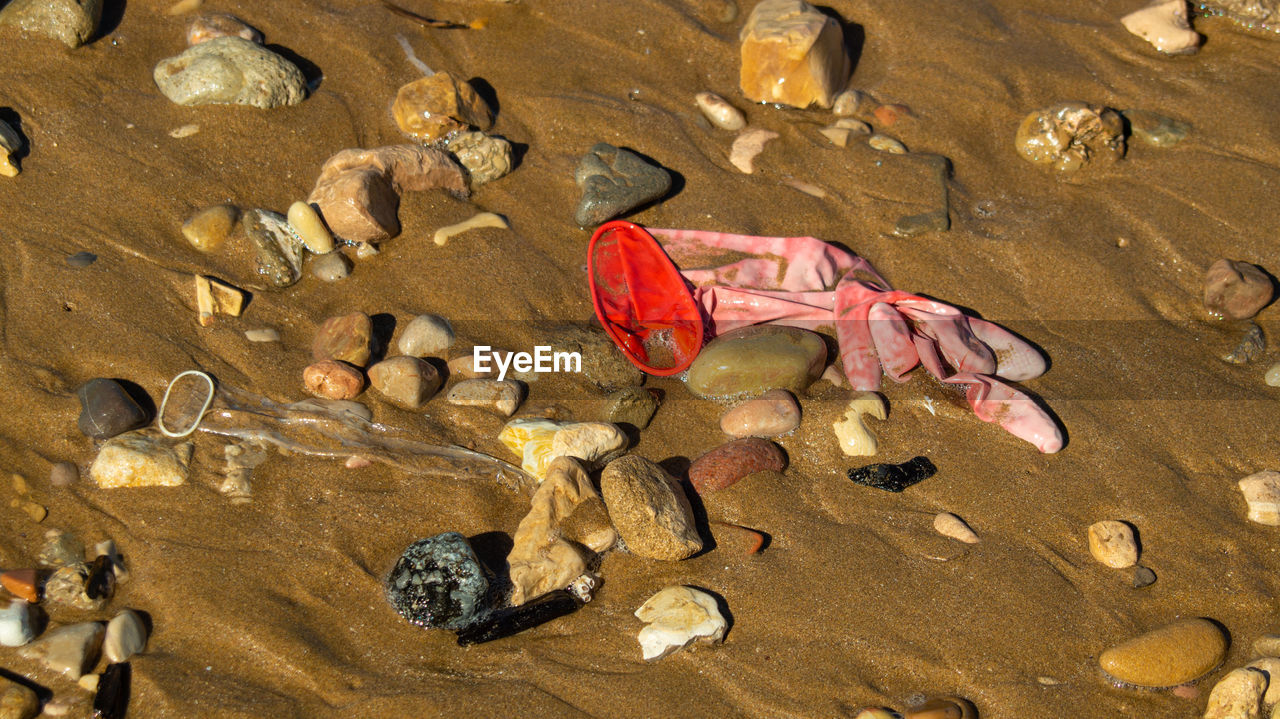 High angle view of pollution plastic rubbish on beach