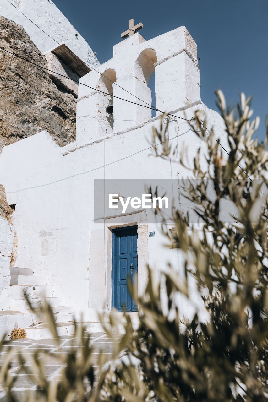 Low angle view of old church, serifos greece cyclades cycladic greek island chora, blue white aegean 