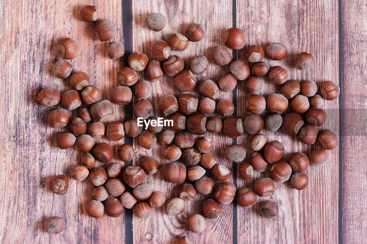 CLOSE-UP OF COFFEE BEANS ON TABLE