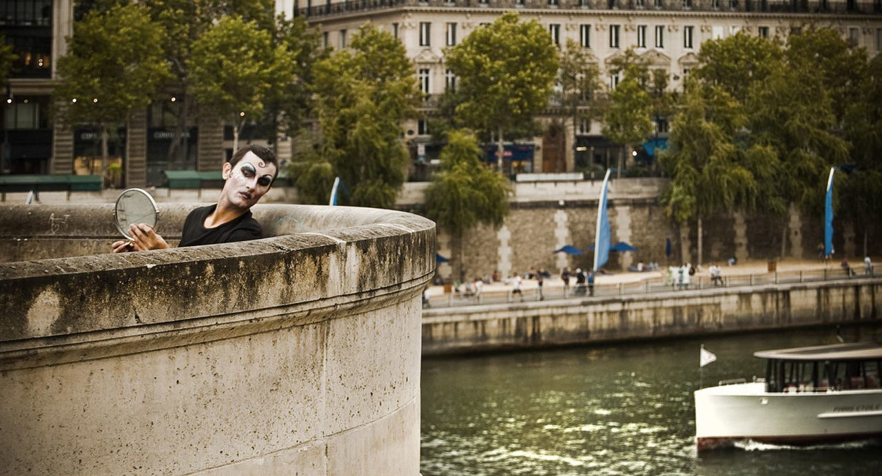 WOMAN SITTING IN WATER