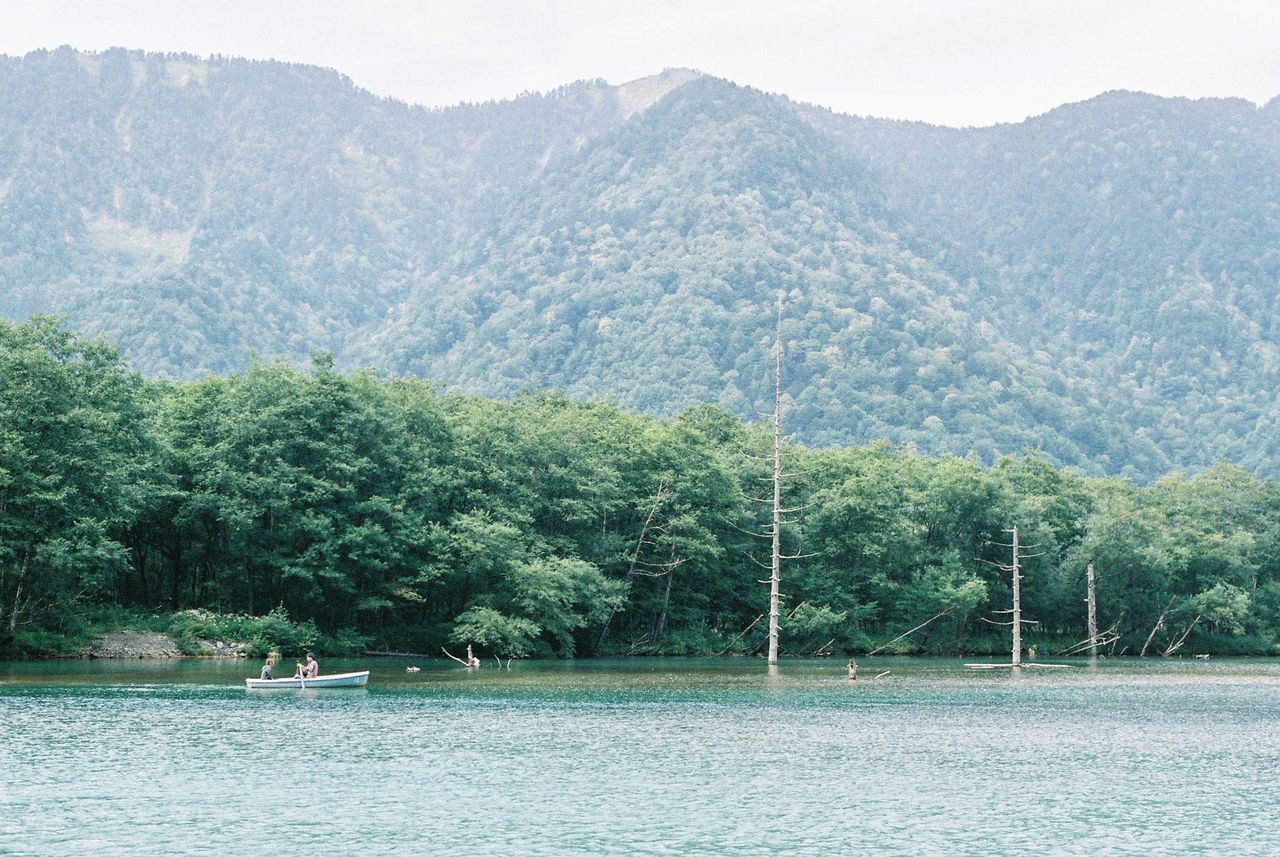 Scenic view of river and mountains