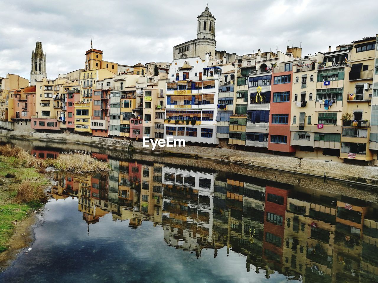 REFLECTION OF BUILDINGS IN WATER