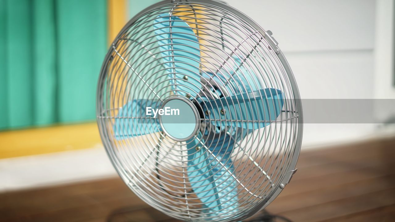 Close-up of electric fan on table