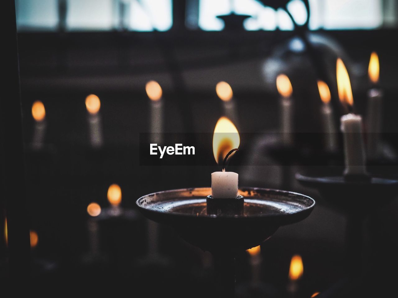 Close-up of candles in church