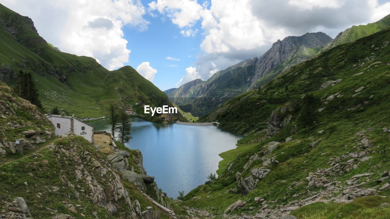 Panoramic view of lake amidst mountains against sky