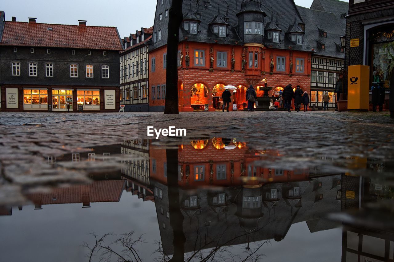 Reflection of buildings in puddle