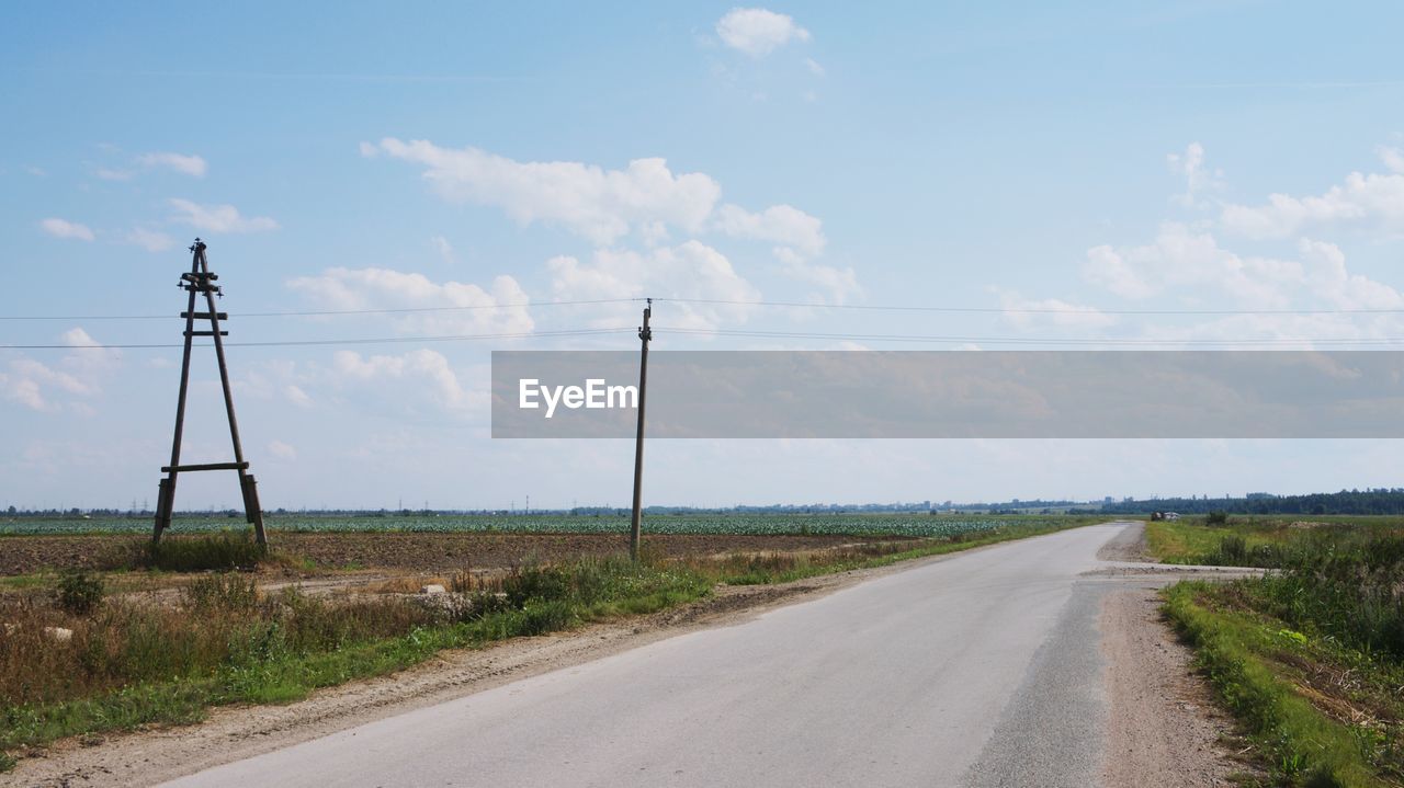 ROAD PASSING THROUGH LAND AGAINST SKY