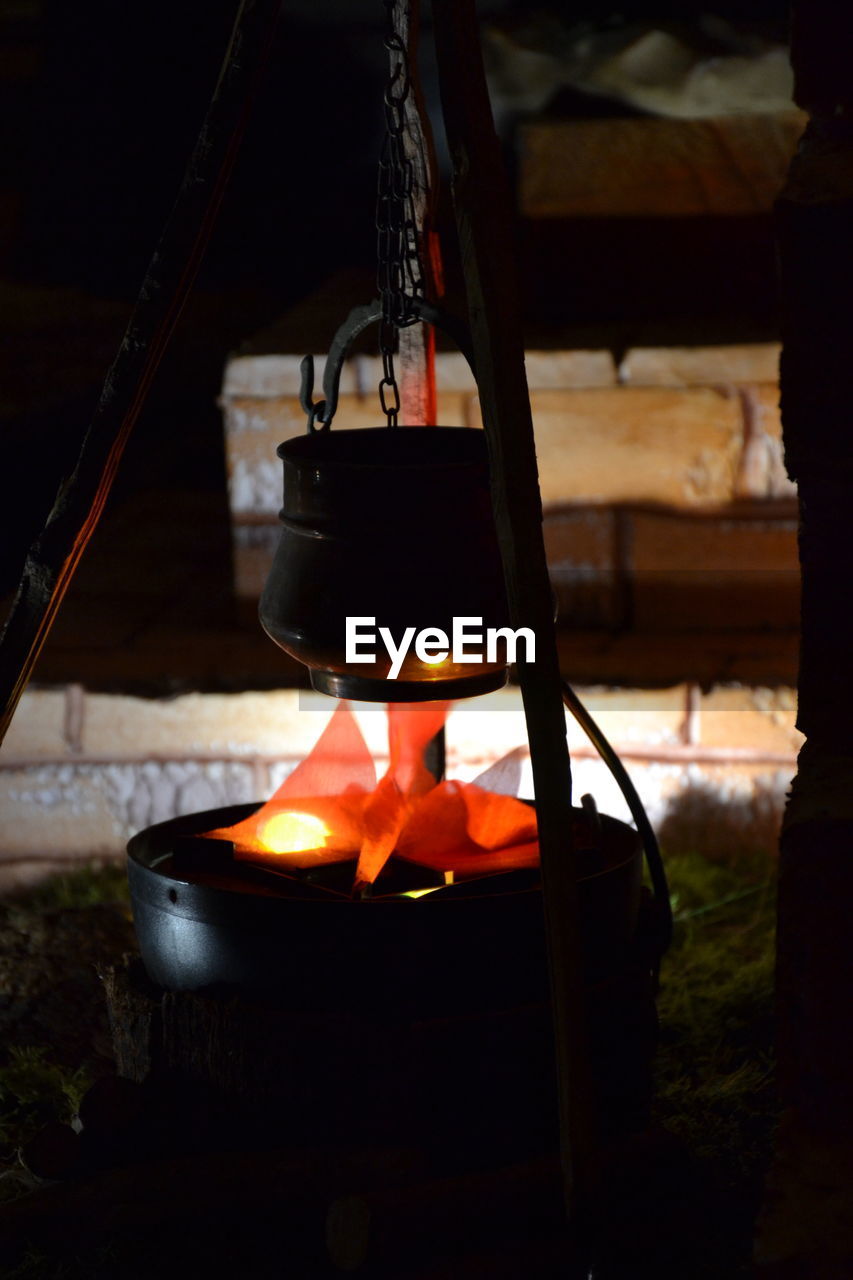 Close-up of container hanging against wall