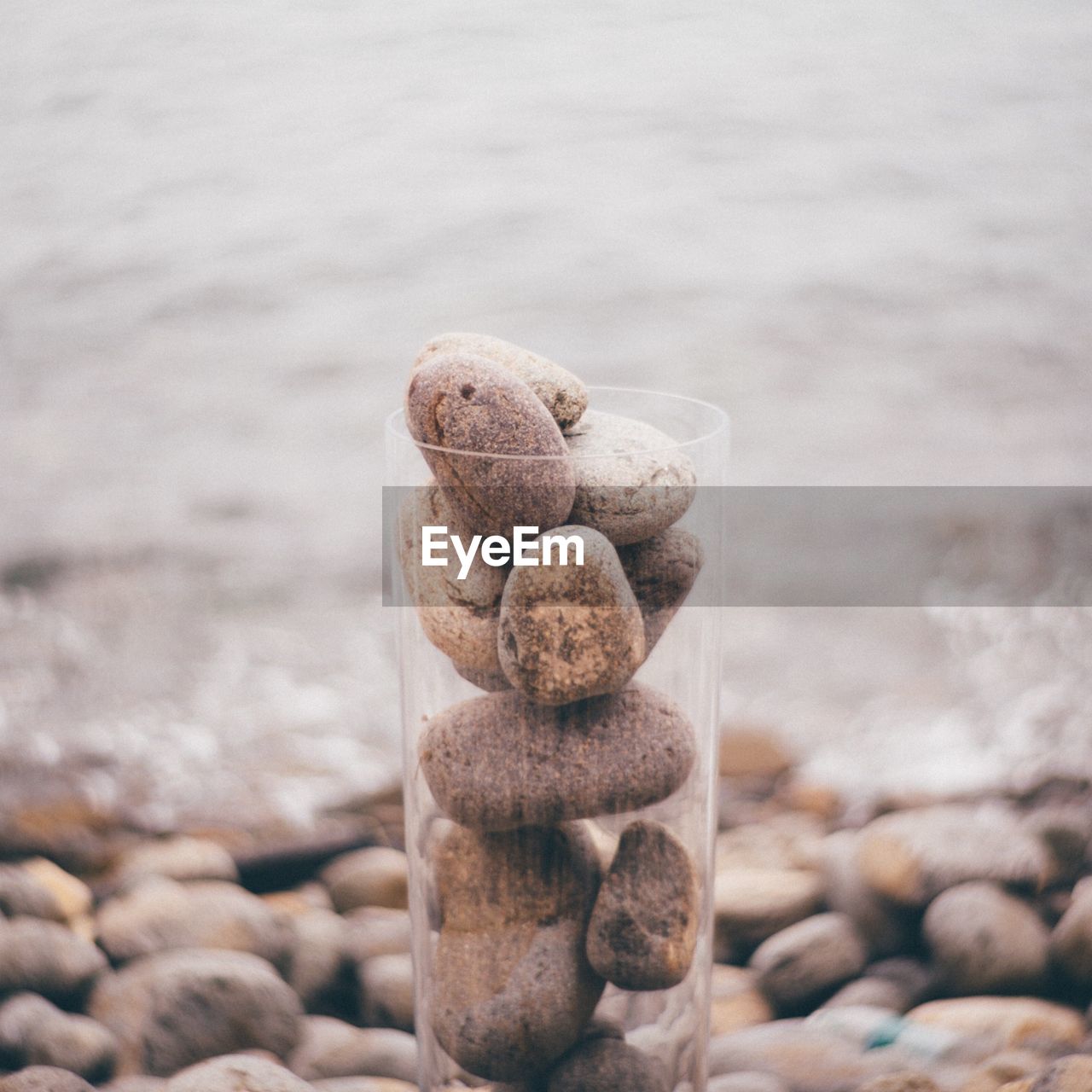 Stack of pebbles in glass