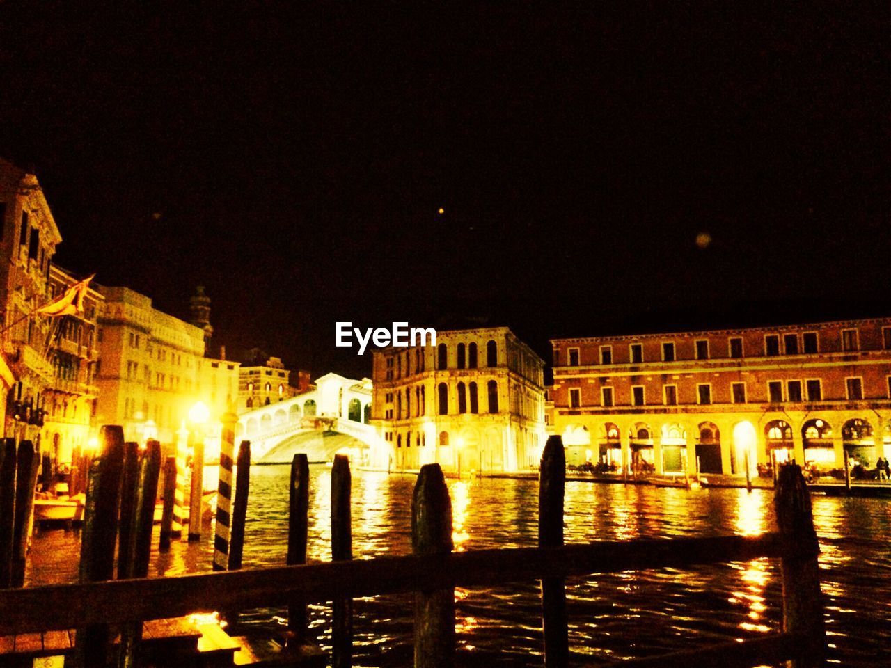 VIEW OF ILLUMINATED BUILDINGS AT NIGHT