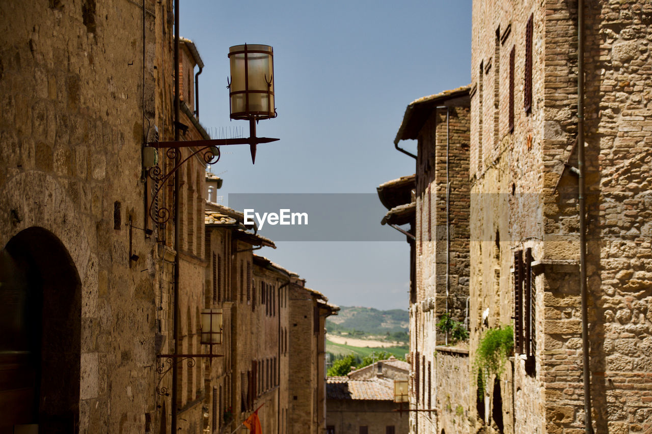 Low angle view of old buildings in san gimignano, an italian town in tuscany, southwest of florence
