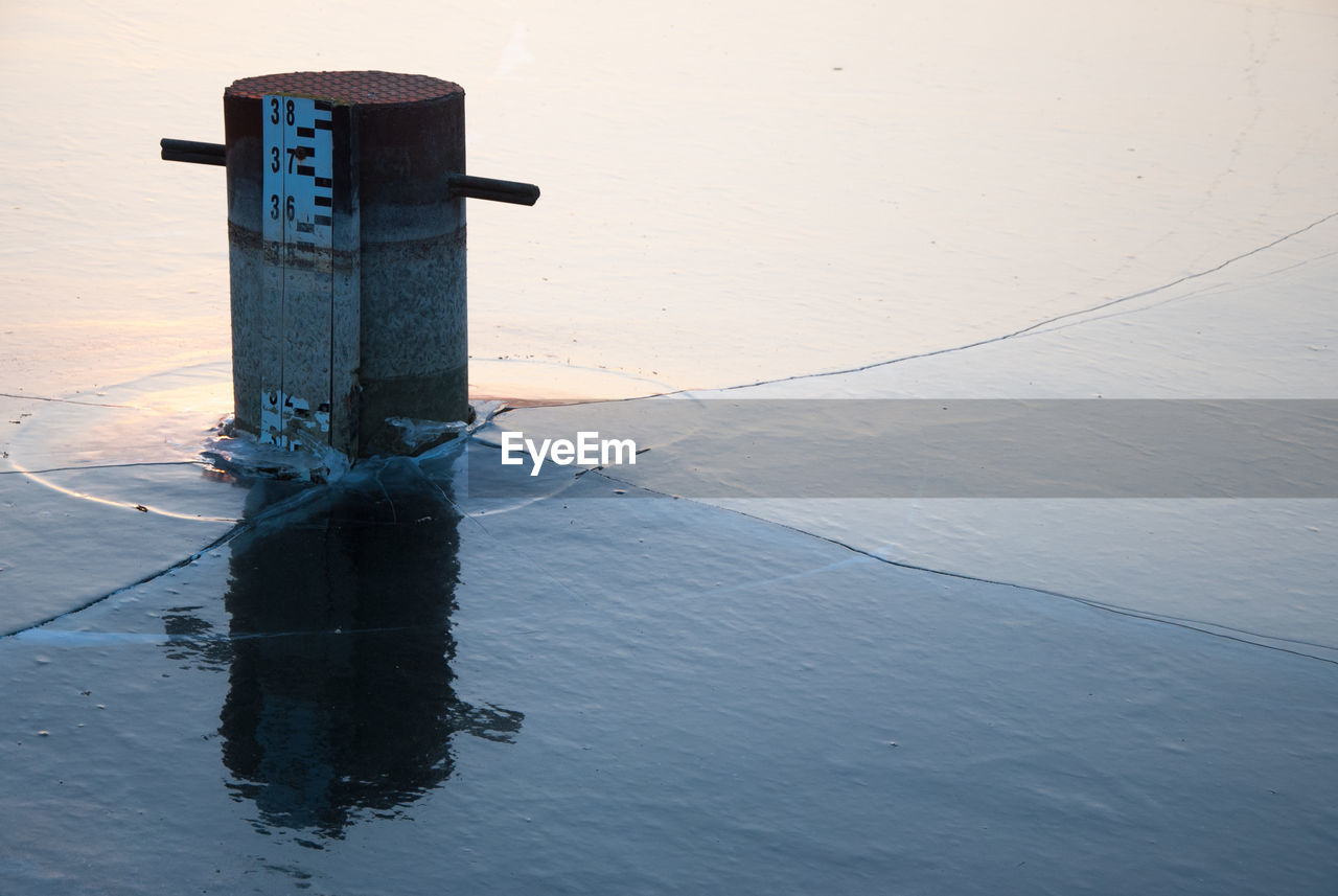 INFORMATION SIGN ON SEA AGAINST SKY