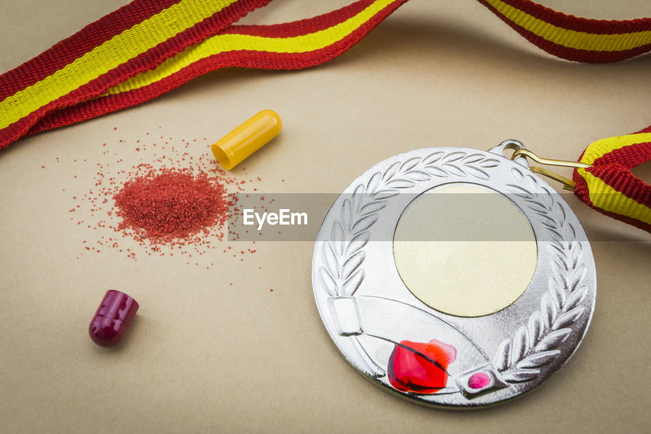 HIGH ANGLE VIEW OF CANDIES ON TABLE AGAINST WHITE BACKGROUND