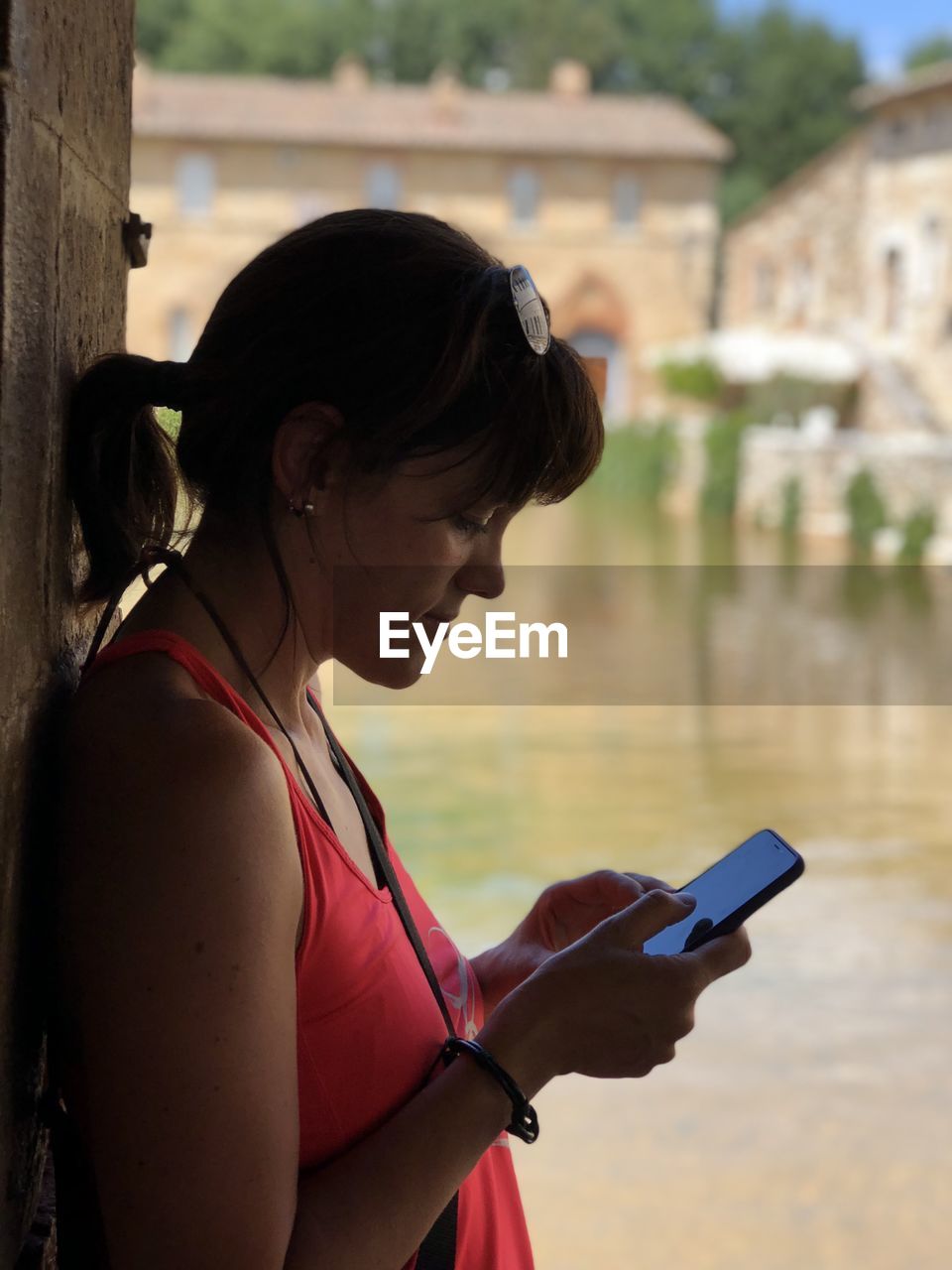 Woman using mobile phone outdoors