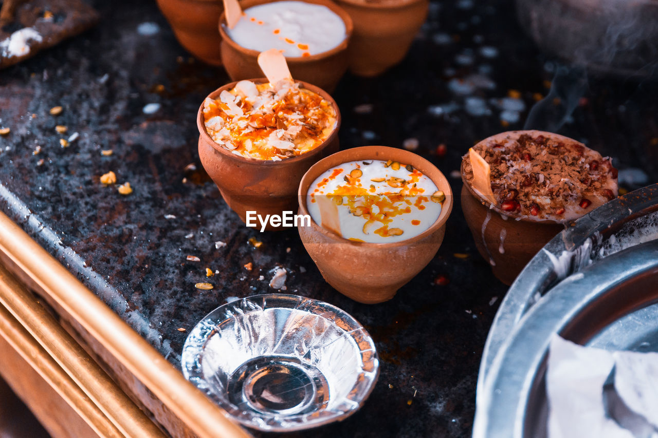 Close-up of lassi served in clay cups