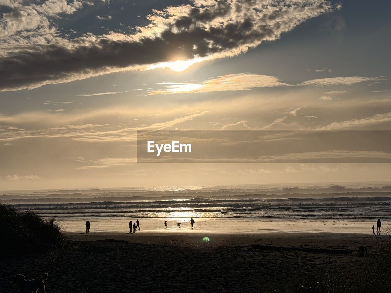 sea, water, sky, beach, land, horizon, nature, beauty in nature, cloud, scenics - nature, sunlight, sunset, holiday, horizon over water, vacation, trip, tranquility, sand, ocean, sun, body of water, travel destinations, travel, dusk, group of people, tranquil scene, tourism, environment, wave, summer, outdoors, leisure activity, evening, silhouette, coastline, seascape, shore, reflection, landscape, coast, idyllic, relaxation, motion, non-urban scene, sports, lifestyles