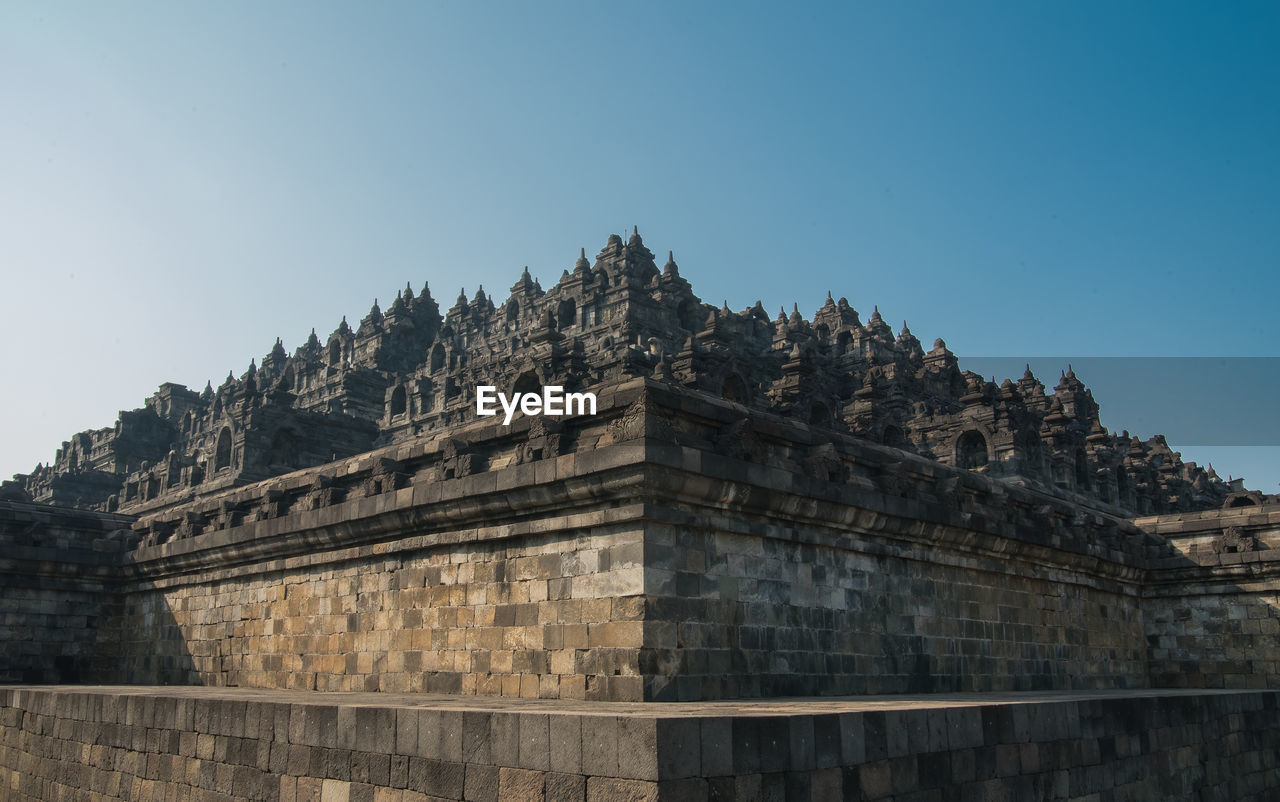 LOW ANGLE VIEW OF TEMPLE AGAINST CLEAR SKY