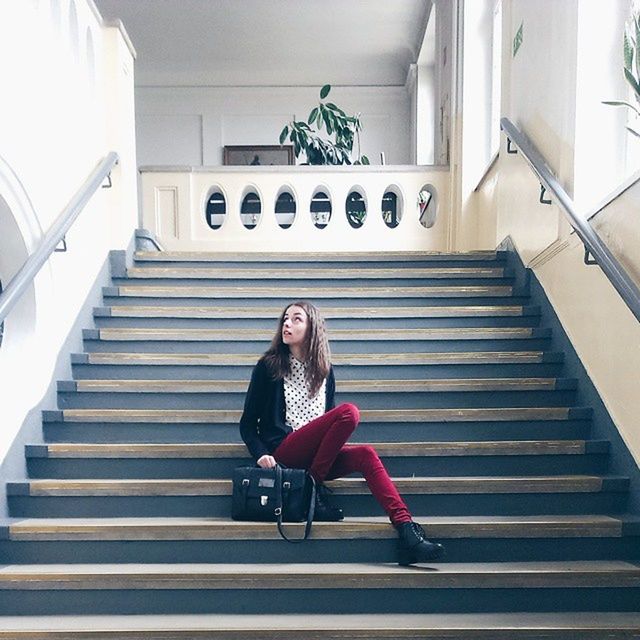 WOMAN CLIMBING STEPS