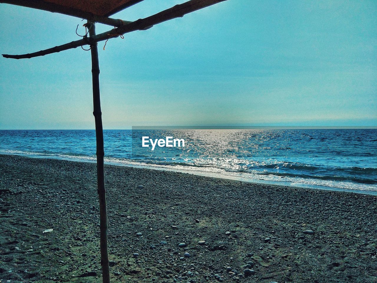 SCENIC VIEW OF BEACH AGAINST CLEAR SKY