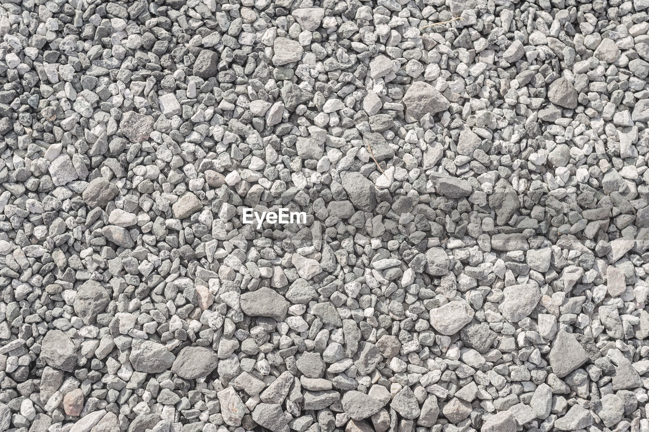 backgrounds, full frame, asphalt, gravel, stone, textured, rubble, no people, rock, soil, day, pebble, high angle view, large group of objects, nature, abundance, road surface, pattern, gray, outdoors, flooring, rough, stone wall, land, cobblestone, stone material, close-up